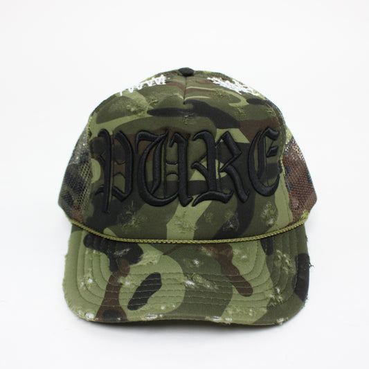 PAIN IS PURE 'PURE' LOGO NEEDLE REPAIR TRUCKER HAT CAMO/BLACK