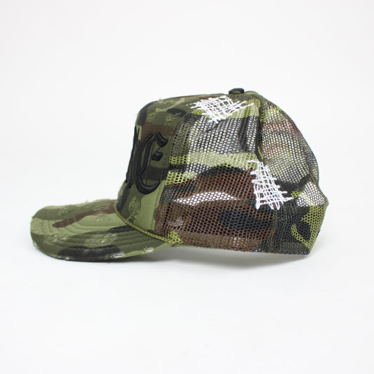 PAIN IS PURE 'PURE' LOGO NEEDLE REPAIR TRUCKER HAT CAMO/BLACK